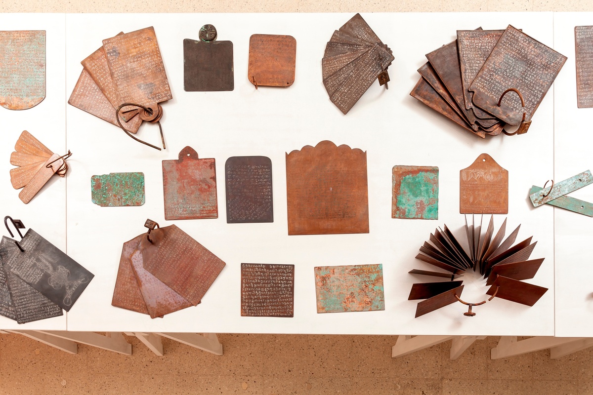 Transcripts (A set of 100 copper plate sculptures based on ancient grants Lost scripts handwritten and etched by the artist with patination Each one a unique piece) Copper